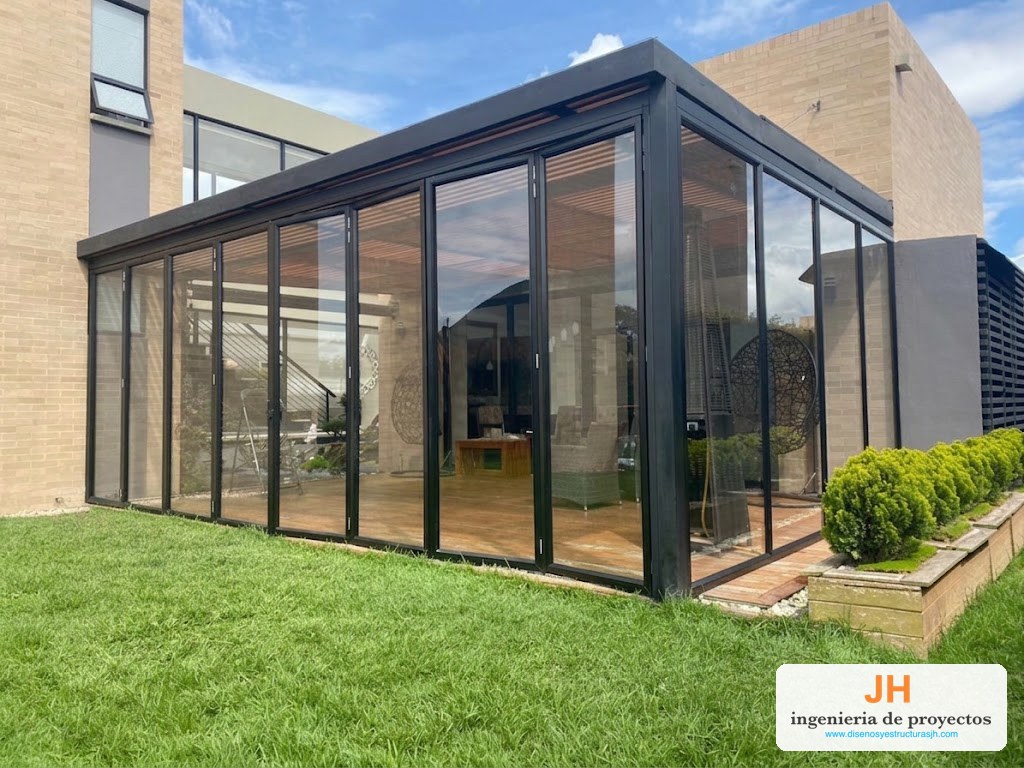 Puertas plegables · cerramiento de jardín – obra de JH en Bogotá